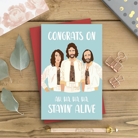 Födelsedagskort – Bee Gees “Congrats On Stayin’ Alive”